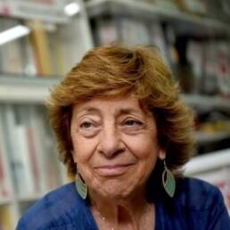 Photo of Mabel Bianco, bookshelves in the background